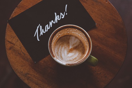 Thank you note and a cup of coffee. Photo by Hanny Naibaho on Unsplash