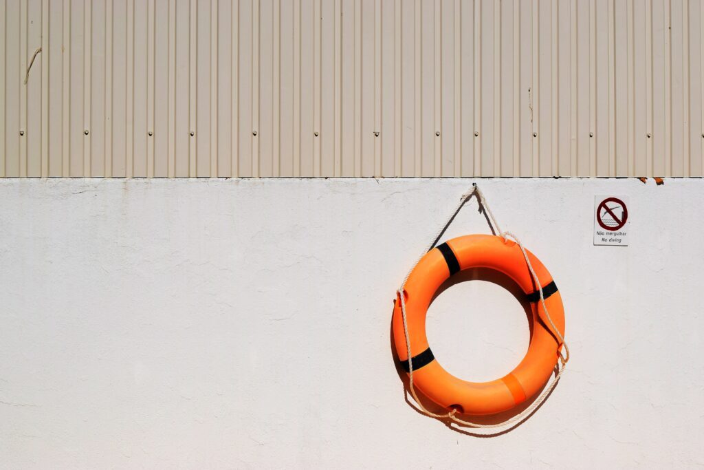 orange life saver ring on a wall